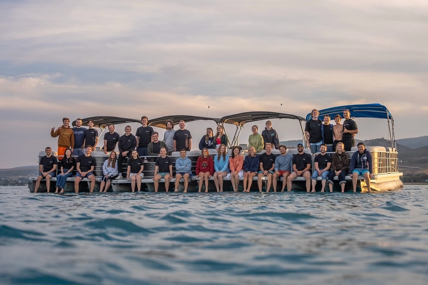 Leland team on the water at sunset